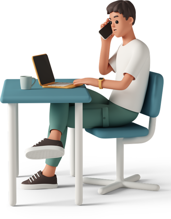 Worker talking on the phone at laptop desk